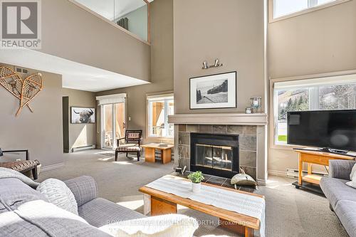 204 - 169 Jozo Weider Boulevard, Blue Mountains, ON - Indoor Photo Showing Living Room With Fireplace