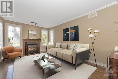 Living room virtually staged - 779 Fletcher Circle, Ottawa, ON - Indoor Photo Showing Living Room With Fireplace