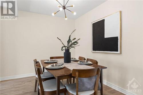 formal dining with modern light fixture! - 2560 Hunters Point Crescent, Ottawa, ON - Indoor Photo Showing Dining Room