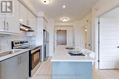 407 - 1105 Leger Way, Milton, ON - Indoor Photo Showing Kitchen With Stainless Steel Kitchen With Double Sink With Upgraded Kitchen