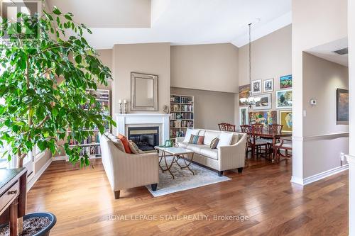 19 - 3230 New Street, Burlington (Roseland), ON - Indoor Photo Showing Living Room With Fireplace