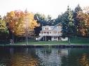 Waterfront - 412 Ch. Du Lac-Des-Chats, Saint-Sauveur, QC  - Outdoor With Body Of Water 