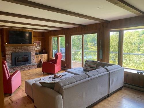 Living room - 412 Ch. Du Lac-Des-Chats, Saint-Sauveur, QC - Indoor Photo Showing Living Room With Fireplace