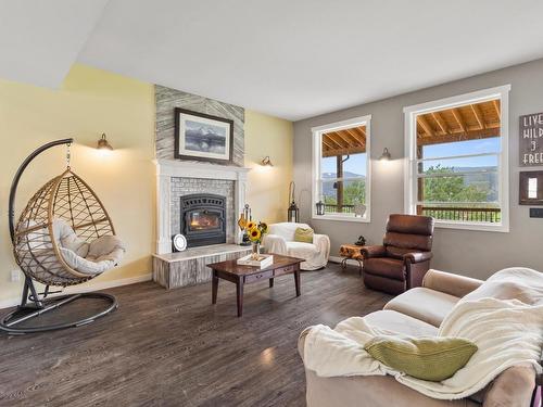 8075 Westsyde Rd, Kamloops, BC - Indoor Photo Showing Living Room With Fireplace