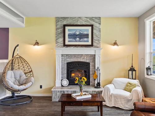 8075 Westsyde Rd, Kamloops, BC - Indoor Photo Showing Living Room With Fireplace