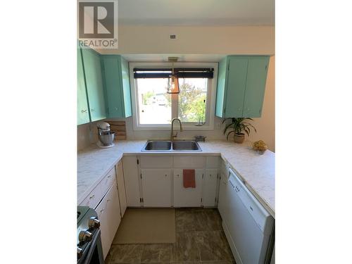 5524 53 Street, Fort Nelson, BC - Indoor Photo Showing Kitchen With Double Sink