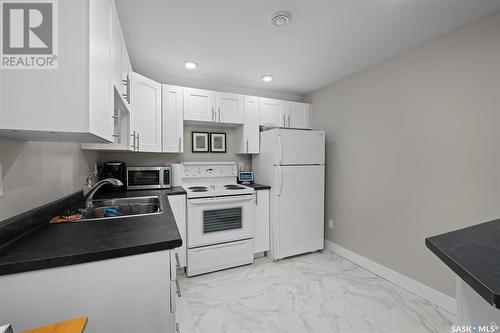 543 25Th Street W, Prince Albert, SK - Indoor Photo Showing Kitchen With Double Sink