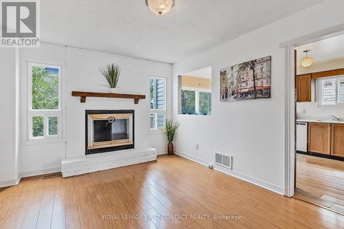 9 Carr Drive N, Barrie, ON - Indoor Photo Showing Living Room With Fireplace