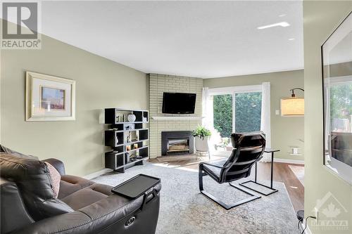 25 Chisholm Court, Ottawa, ON - Indoor Photo Showing Living Room With Fireplace