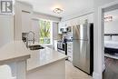 220 - 1733 Queen Street E, Toronto (The Beaches), ON  - Indoor Photo Showing Kitchen With Double Sink 