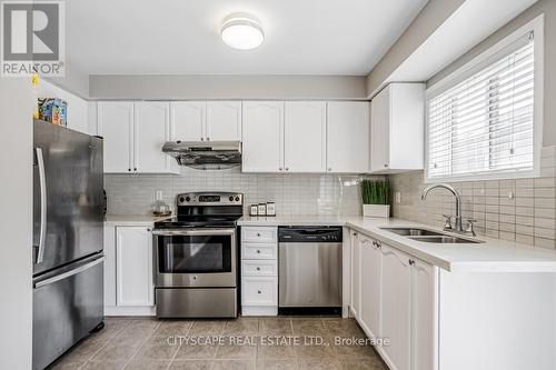 100 - 601 Shoreline Drive, Mississauga (Cooksville), ON - Indoor Photo Showing Kitchen With Stainless Steel Kitchen With Double Sink With Upgraded Kitchen