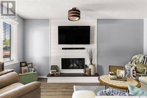 14 Cole Crescent, Regina, SK - Indoor Photo Showing Living Room With Fireplace