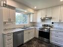 118 Brigade Drive, Prince George, BC  - Indoor Photo Showing Kitchen With Double Sink 