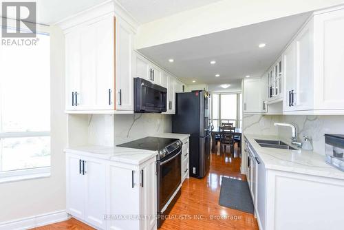 1010 - 20 Cherrytree Drive, Brampton, ON - Indoor Photo Showing Kitchen With Double Sink