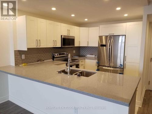 1402 - 7601 Bathurst Street, Vaughan, ON - Indoor Photo Showing Kitchen With Double Sink