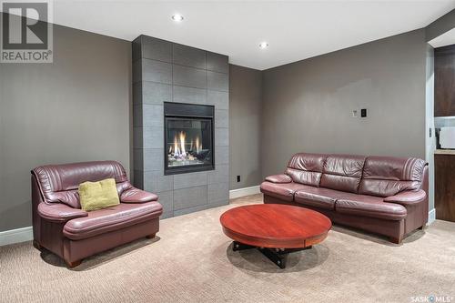 102 Milne Crescent, Saskatoon, SK - Indoor Photo Showing Living Room With Fireplace