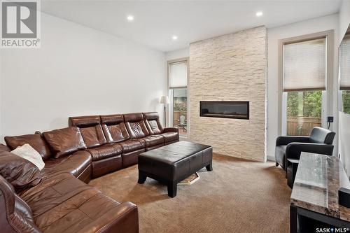 102 Milne Crescent, Saskatoon, SK - Indoor Photo Showing Living Room With Fireplace