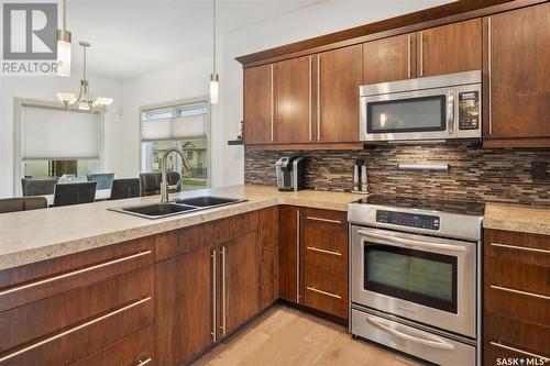 102 Milne Crescent, Saskatoon, SK - Indoor Photo Showing Kitchen With Double Sink With Upgraded Kitchen