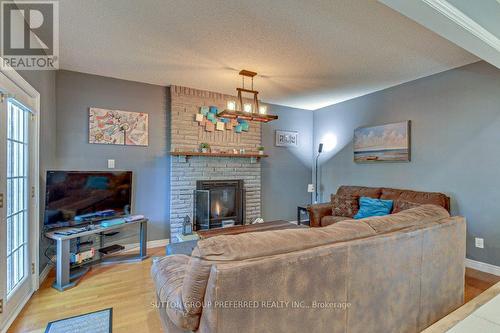 100 Midale Crescent, London, ON - Indoor Photo Showing Living Room With Fireplace