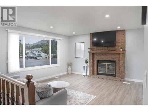 305 Ziprick Road, Kelowna, BC - Indoor Photo Showing Living Room With Fireplace