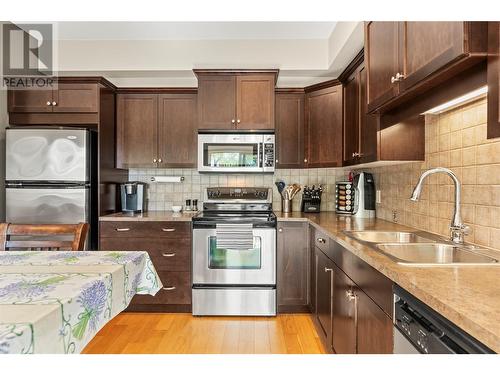 4900 Heritage Drive Unit# 303, Vernon, BC - Indoor Photo Showing Kitchen With Stainless Steel Kitchen With Double Sink