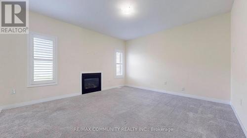 14 Lamb Avenue, Kawartha Lakes, ON - Indoor Photo Showing Other Room With Fireplace