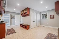 Huge mudroom with fabulous storage outside of the triple car garage - 