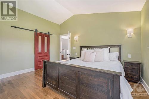 Lovely primary room with extraordinary second level deck to enjoy the sunset from - 6548 Carp Road, Ottawa, ON - Indoor Photo Showing Bedroom