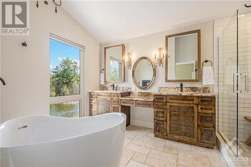 Gorgeous ensuite with soaker tub and glass encased walk in shower - 6548 Carp Road, Ottawa, ON - Indoor Photo Showing Bathroom