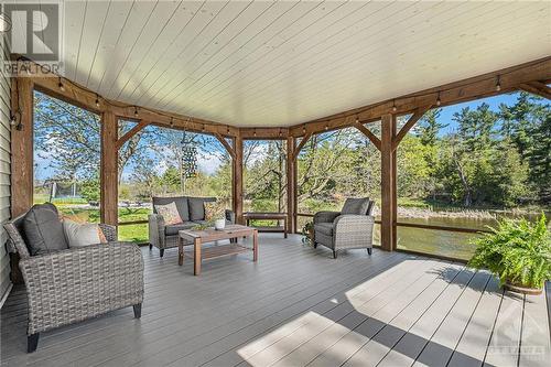 Incredible screened in porch overlooking the river - 6548 Carp Road, Ottawa, ON - Outdoor With Deck Patio Veranda With Exterior