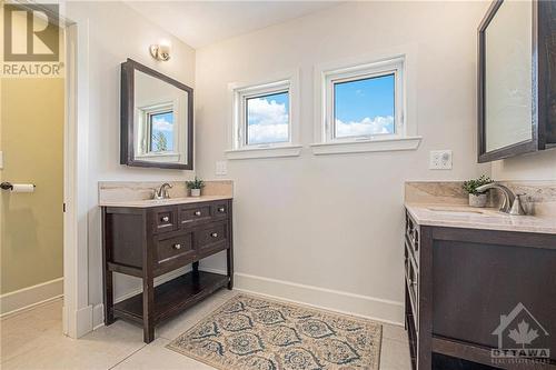 Functional bathroom with two separate sinks and separate toilet and bath area - 6548 Carp Road, Ottawa, ON - Indoor Photo Showing Bathroom