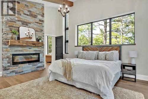 735 Fire Route 93, Havelock-Belmont-Methuen, ON - Indoor Photo Showing Bedroom With Fireplace