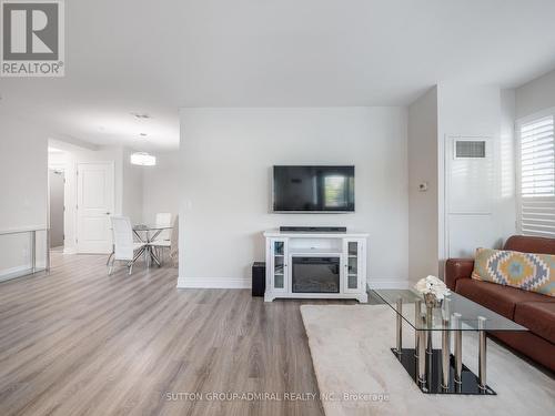 101B - 9090 Yonge Street, Richmond Hill (South Richvale), ON - Indoor Photo Showing Living Room With Fireplace