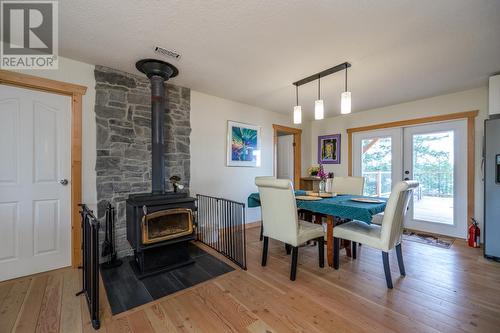 51795 Guest Road, Cluculz Lake, BC - Indoor Photo Showing Dining Room With Fireplace