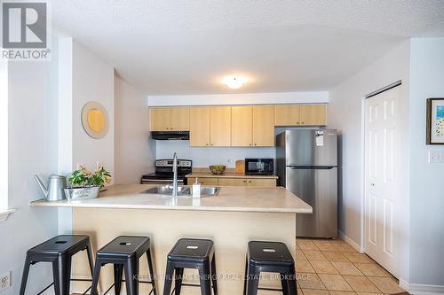 301 - 91 Aspen Springs Drive, Clarington (Bowmanville), ON - Indoor Photo Showing Kitchen With Double Sink