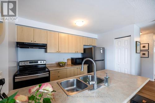 301 - 91 Aspen Springs Drive, Clarington (Bowmanville), ON - Indoor Photo Showing Kitchen With Double Sink