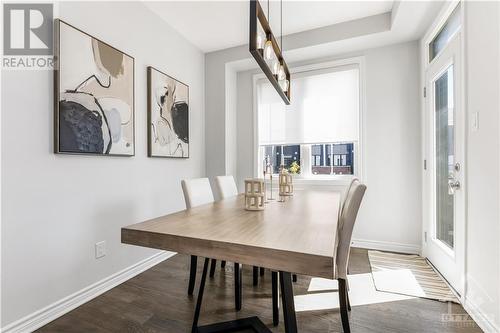 The dining area offers easy access to a charming second-floor balcony with beautiful neighbourhood views. - 97 Ballinora Lane, Ottawa, ON - Indoor Photo Showing Dining Room