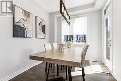 The dining area offers easy access to a charming second-floor balcony with beautiful neighbourhood views. - 