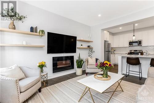 97 Ballinora Lane, Ottawa, ON - Indoor Photo Showing Living Room With Fireplace