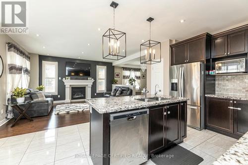 51 Prady Lane, New Tecumseth, ON - Indoor Photo Showing Kitchen With Fireplace With Double Sink With Upgraded Kitchen