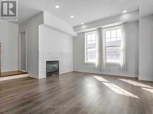 54 Cathedral High Street, Markham (Cathedraltown), ON - Indoor Photo Showing Living Room With Fireplace