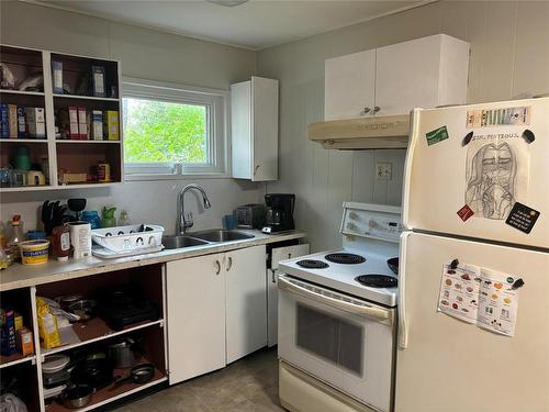 151 2Nd Street, Brandon, MB - Indoor Photo Showing Kitchen With Double Sink