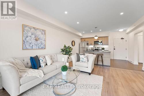 506 - 4 Spice Way, Barrie, ON - Indoor Photo Showing Living Room