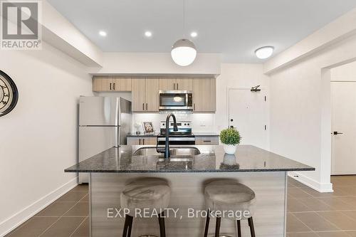 506 - 4 Spice Way, Barrie, ON - Indoor Photo Showing Kitchen With Stainless Steel Kitchen With Upgraded Kitchen