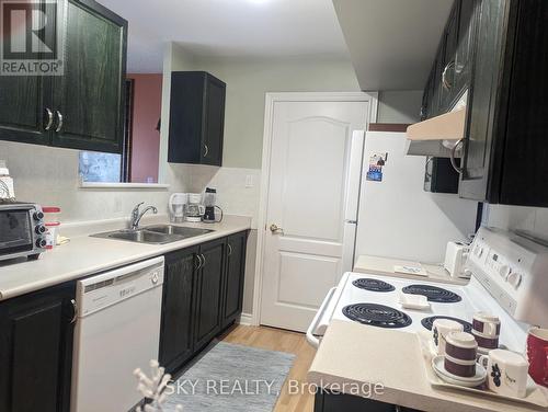 707 - 10 Dayspring Circle, Brampton (Goreway Drive Corridor), ON - Indoor Photo Showing Kitchen With Double Sink