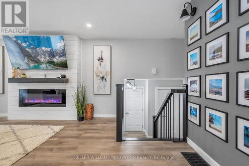 15 Miller Crescent, Norfolk (Simcoe), ON - Indoor Photo Showing Other Room With Fireplace