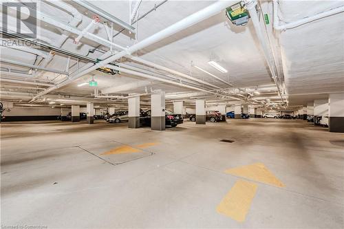 Private Underground Parking - 399 Queen St S Street Unit# 102, Kitchener, ON - Indoor Photo Showing Garage