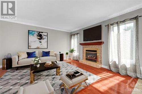 Virtually Staged - 51 Deerfox Drive, Ottawa, ON - Indoor Photo Showing Living Room With Fireplace