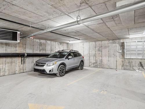 Parking - 409-10120 Rue Lauraine-Vaillancourt, Montréal (Ahuntsic-Cartierville), QC - Indoor Photo Showing Garage