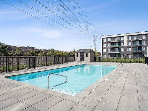 Piscine - 409-10120 Rue Lauraine-Vaillancourt, Montréal (Ahuntsic-Cartierville), QC - Outdoor With In Ground Pool